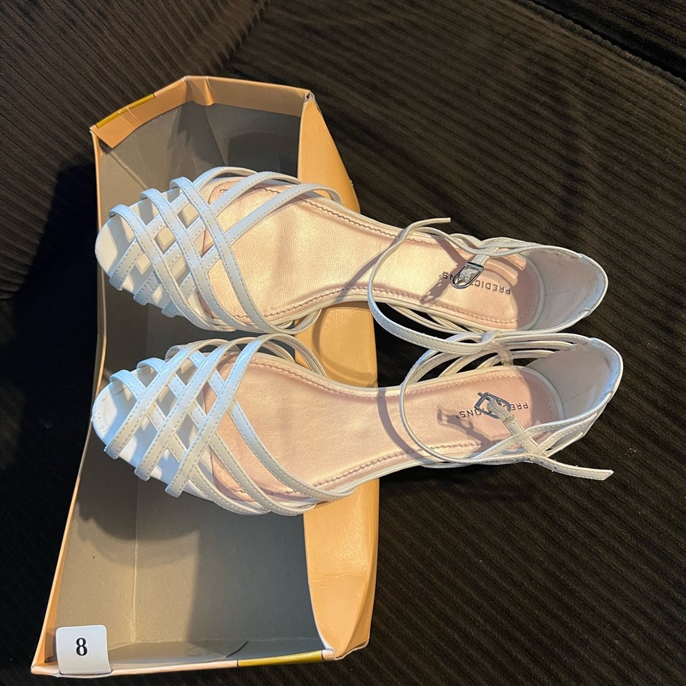 White strappy sandals with tiny heel. Women’s size 8. Barely worn.